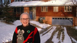 Ann T. Anthony poses for a photo in front of her home